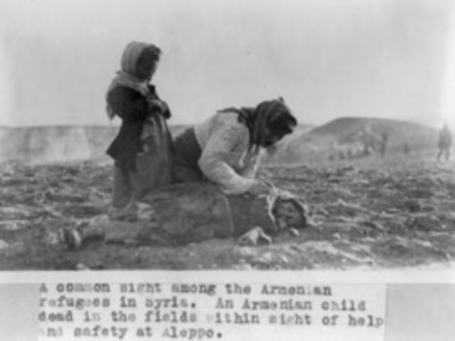 grieving Armenian family in field